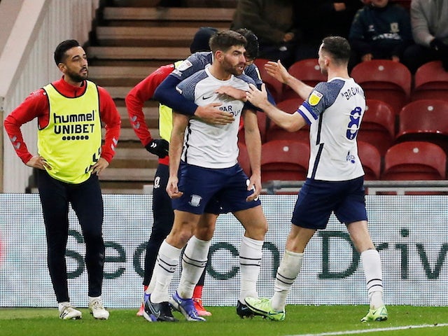 Preston North End's Ched Evans celebrates scoring their first goal with teammates on November 23, 2021