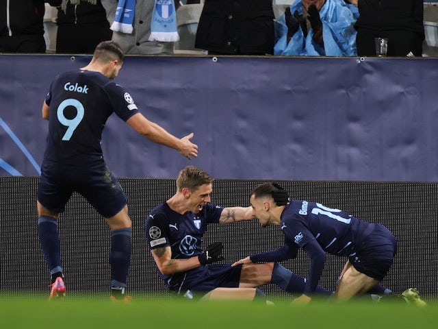 Malmö FF's Soren Riks celebrates after scoring his first goal alongside Antonio Korak and Veliko Virmancevic on 23 November 2021