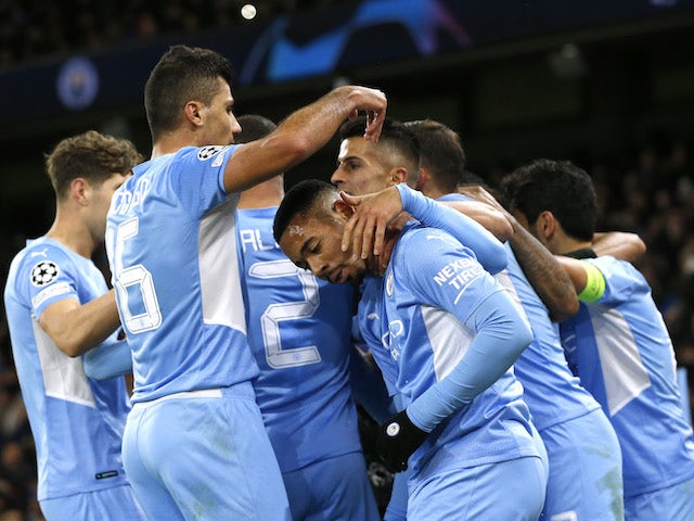 Manchester City's Gabriel Jesus celebrates scoring their second goal with teammates on November 24, 2021