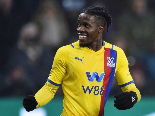 Crystal Palace's Wilfried Zaha celebrates their third goal scored by Marc Guehi, November 20, 2021
