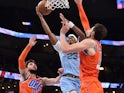 Memphis Grizzlies guard Jarrett Culver goes to the basket against Oklahoma City Thunder center Mike Muscala on December 2, 2021