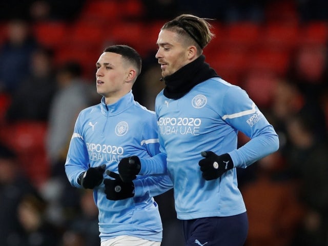 Manchester City's Phil Foden and Jack Grealish during the warm up on December 4, 2021