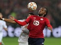 Lille's Renato Sanches in action with Sevilla's Marcos Acuna, October 20, 2021