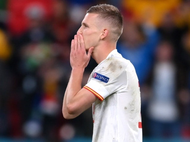 Spain's Dani Olmo reacts after missing a penalty during the shoot-out, July 6, 2021