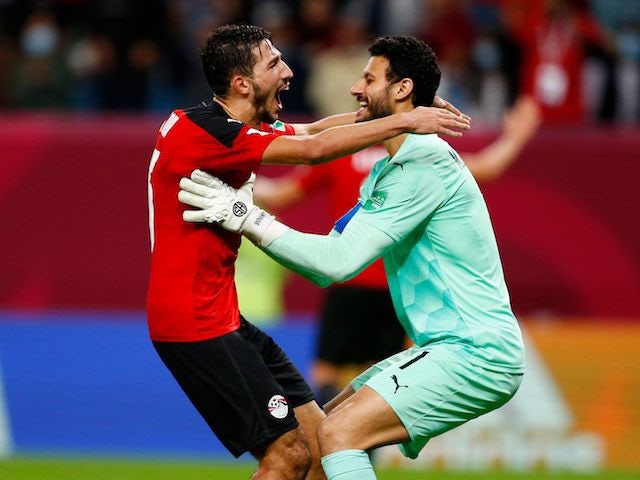 Egypt's Mohamed El Shenawy and Ahmed Abou El Fotouh celebrate after the match on December 7, 2021