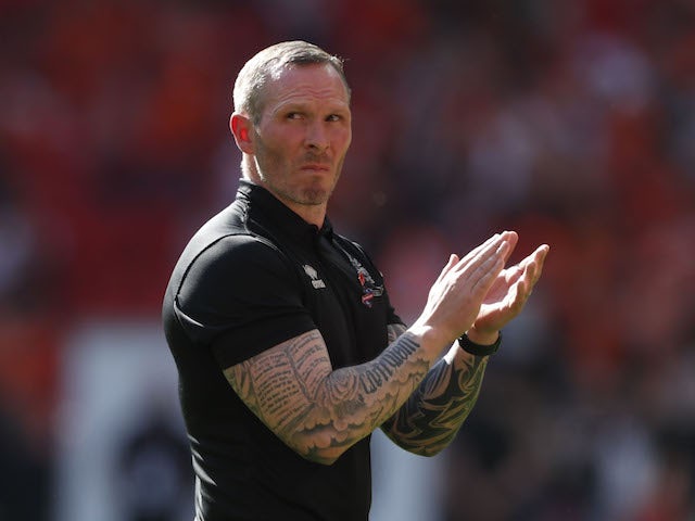 Lincoln City manager Michael Appleton looks dejected as he applauds fans after the match in May 202