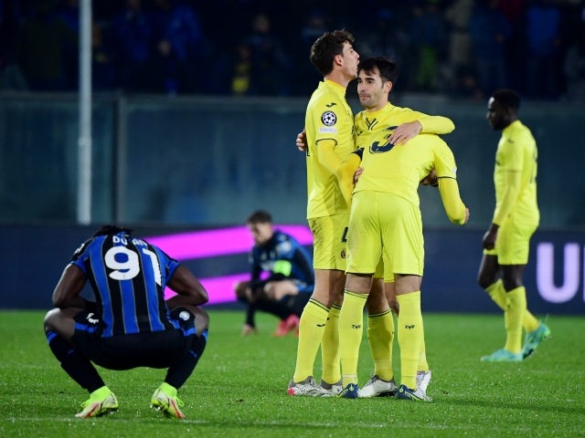 Villarreal's Pau Torres celebrates with teammates as Villarreal qualify for the last 16 of the Champions League on December 9, 2021