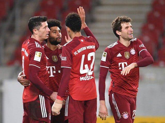 Bayern Munich's Serge Gnabry celebrates scoring their fifth goal with teammates on December 14, 2021