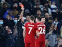Liverpool's Andrew Robertson is shown a red card by referee Paul Tierney on December 19, 2021