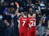 Liverpool's Andrew Robertson is shown a red card by referee Paul Tierney on December 19, 2021