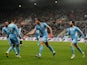 Manchester City's Ruben Dias celebrates scoring their first goal with teammates on December 19, 2021