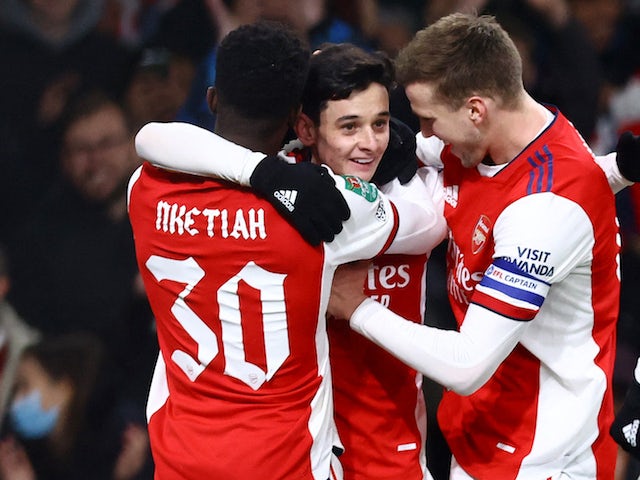 Arsenal's Charlie Patino celebrates scoring five goals alongside Eddie Nketiah and Rob Holding on 21 December 2021
