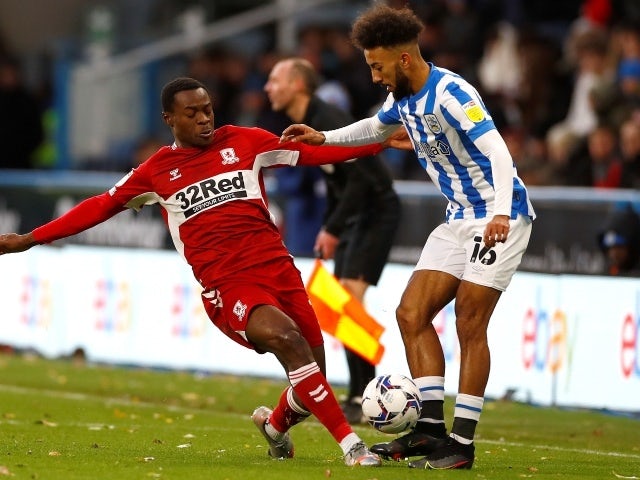 Middlesbrough's Marc Bola in action with Huddersfield Town's Sorba Thomas, November 27, 2021
