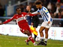 Middlesbrough's Marc Bola in action with Huddersfield Town's Sorba Thomas, November 27, 2021