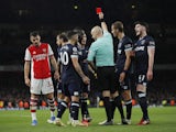 West Ham United's Vladimir Coufal is shown a red card by referee Anthony Taylor after conceding a penalty against Arsenal's Alexandre Lacazette on December 15, 2021