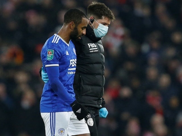 Leicester City's Ricardo Pereira is helped off the pitch after sustaining an injury, December 22, 2021