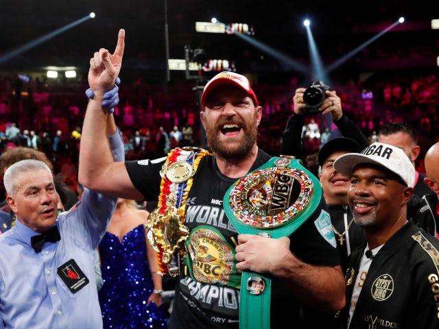 Tyson Fury celebrating after defeating Deontay Wilder on October 9, 2021.