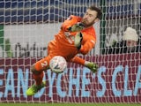  Burnley's Will Norris saves the penalty of Milton Keynes Dons' Lasse Sorenson during the penalty shootout, January 9, 2021