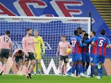 Crystal Palace's Jeffrey Schlupp celebrates scoring their first goal with teammates against Sheffield United on January 2, 2021