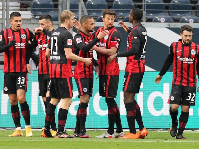 Eintracht Frankfurt's Amin Younes celebrates scoring their first goal with teammates on January 2, 2021