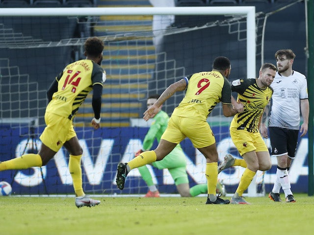 Watford's Tom Cleverley celebrates scoring their first goal with teammates against Swansea City on January 2, 2021