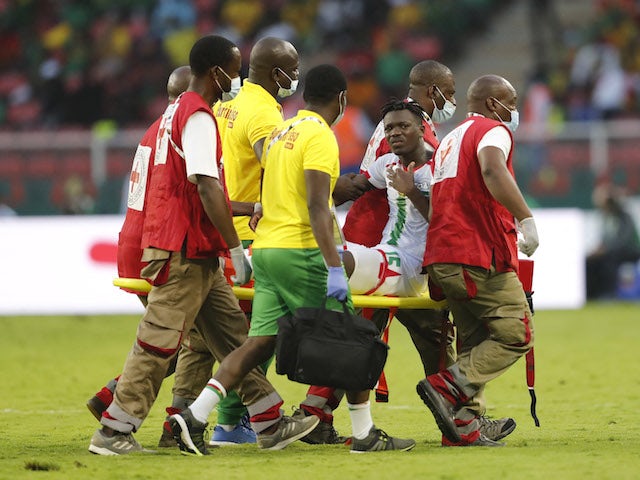 Burkina Faso's Abdoul-Fessal Tapsoba is stretchered off after sustaining an injury on January 9, 2022