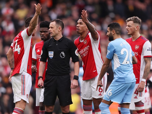 Arsenal's Granit Xhaka remonstrates with referee Stuart Attwell on January 1, 2022
