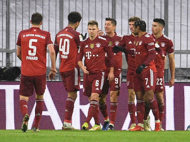 Bayern Munich's Robert Lewandowski celebrates scoring their first goal with teammates on January 7, 2022