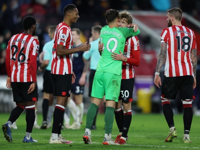 Brentford's Mads Roerslev celebrates with Alvaro Fernandez and Ethan Pinnock after their win against Aston Villa on January 2, 2022