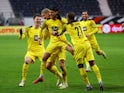 Borussia Dortmund's Mahmoud Dahoud celebrates scoring their third goal with Erling Braut Haaland, Donyell Malen and Thomas Meunier on January 8, 2022