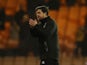 Port Vale manager Darrell Clarke applauds fans after the match on January 8, 2022