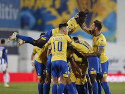 Estoril Praia's Arthur celebrates scoring their first goal with Andre Franco, Coly Racine and teammates on January 8, 2022