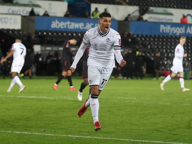 Swansea City's Joel Piroe celebrates scoring their first goal on January 8, 2022