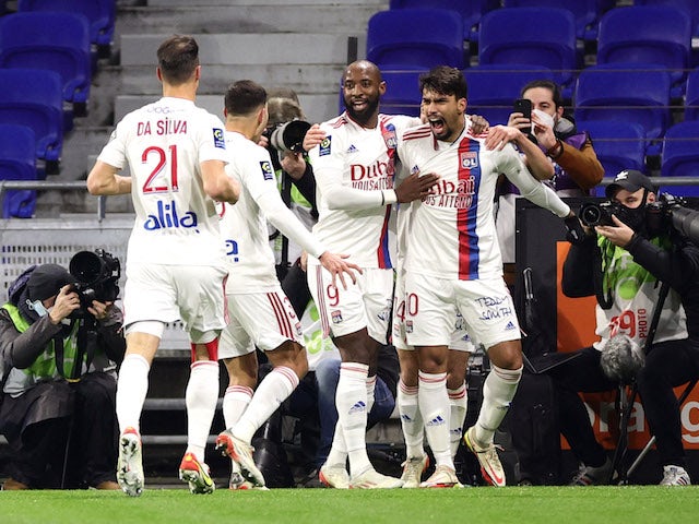 Olympique Lyonnais' Lucas Paqueta celebrates scoring their first goal with teammates on January 9, 2022