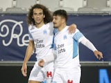 Marseille's Cengiz Under celebrates scoring their first goal with Matteo Guendouzi on January 7, 2022