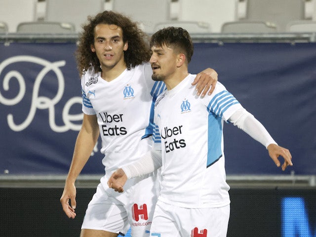 Marseille's Cengiz Under celebrates scoring their first goal with Matteo Guendouzi on January 7, 2022