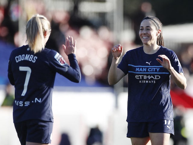 Manchester City Women's Victoria Losada celebrates scoring their sixth goal with Laura Coombs on January 9, 2022