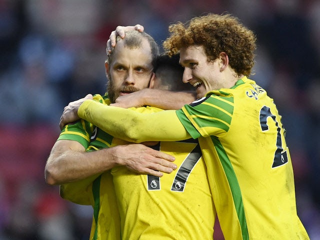 Norwich City's Milot Rashica celebrates scoring their first goal with Teemu Pukki and Josh Sargent on January 9, 2022