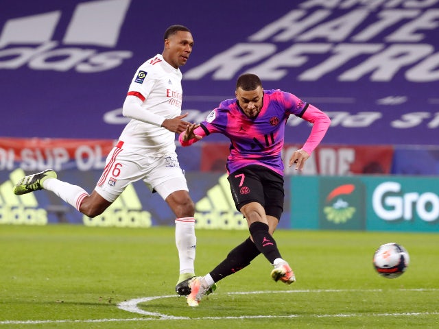 Paris St Germain's Kylian Mbappe scores their fourth goal against Lyon in March 2021