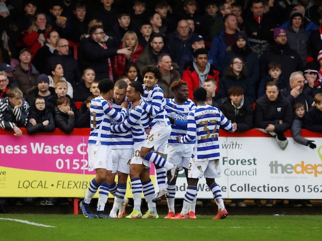 Reading's George Puskas celebrates scoring their first goal with teammates on January 8, 2022