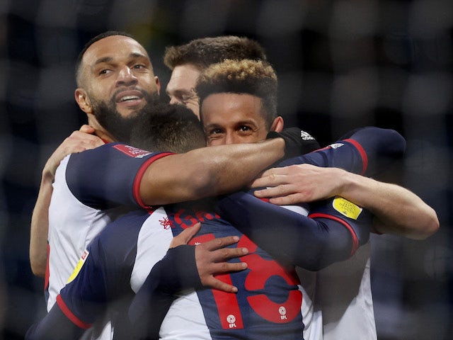 West Bromwich Albion's Callum Robinson celebrates scoring their first goal with Matt Phillips and Karlan Grant  on January 8, 2022