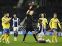 West Bromwich Albion's Cedric Kipre is shown a red card by referee Robert Jones on January 8, 2022