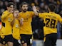 Wolverhampton Wanderers' Daniel Podence celebrates scoring their third goal with Joao Moutinho and Ruben Neves on January 9, 2022
