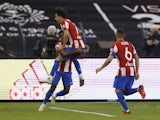 Atletico Madrid's Thomas Lemar and Joao Felix celebrate after Athletic Bilbao's Unai Simon scores an own goal and Atletico Madrid's first on January 13, 2022