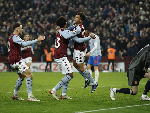 Aston Villa's Philippe Coutinho celebrates scoring their second goal with Carney Chukwuemeka and Matty Cash on January 15, 2022