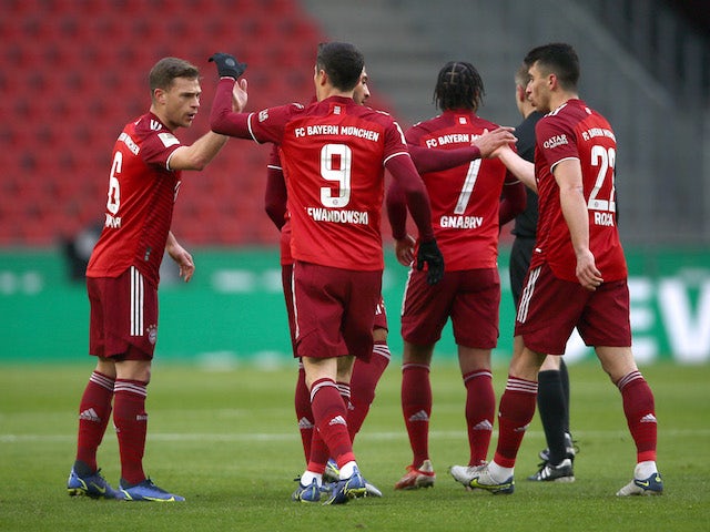 Bayern Munich's Robert Lewandowski celebrates scoring their first goal with teammates on January 15, 2022