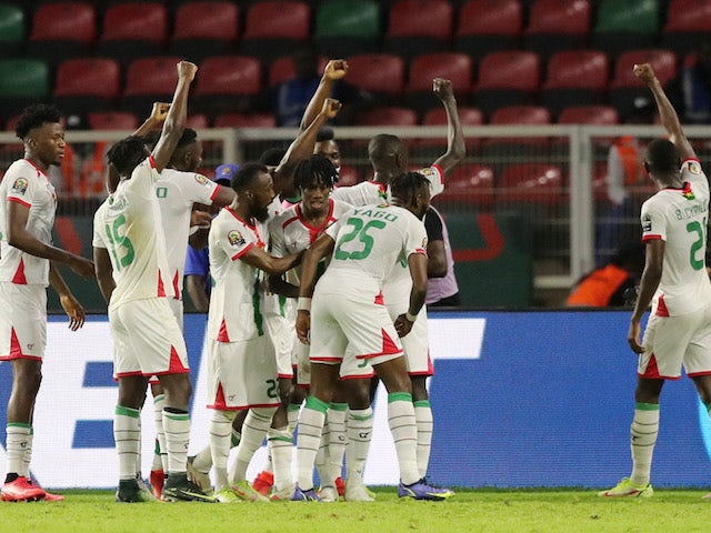 Burkina Faso's Hassane Bande celebrates scoring their first goal with teammates on January 13, 2022