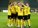 Borussia Dortmund's Thomas Meunier celebrates scoring their first goal with teammates on January 14, 2022
