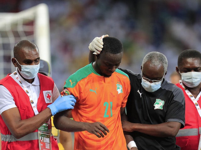 Ivory Coast's Eric Bailly receives medical attention after sustaining an injury on January 16, 2022