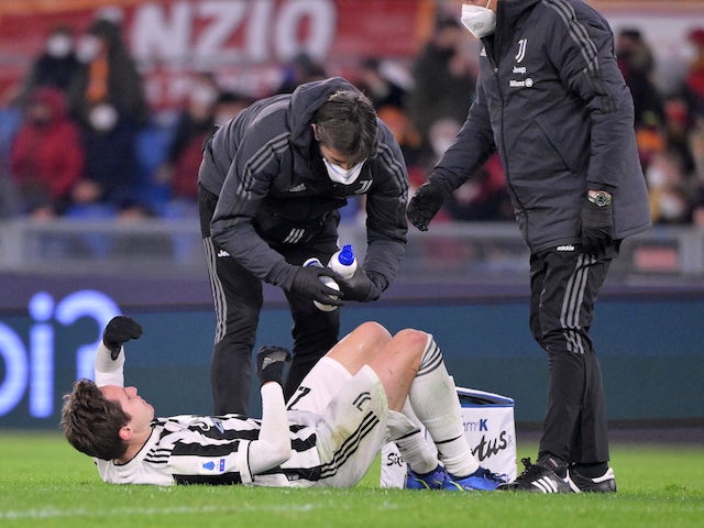 Juventus' Federico Chiesa receives medical attention after sustaining an injury on January 9, 2022